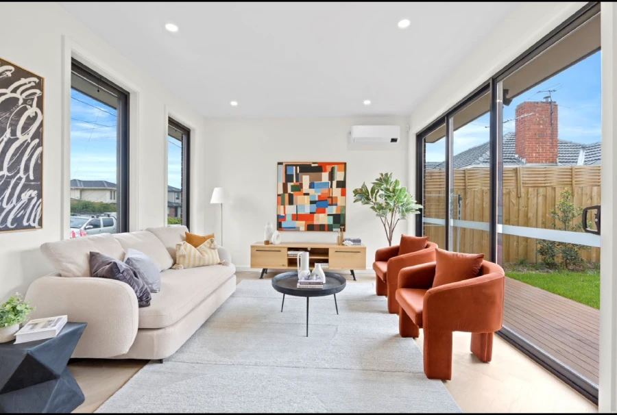 Living room with large windows and flooring in an Australia private villa