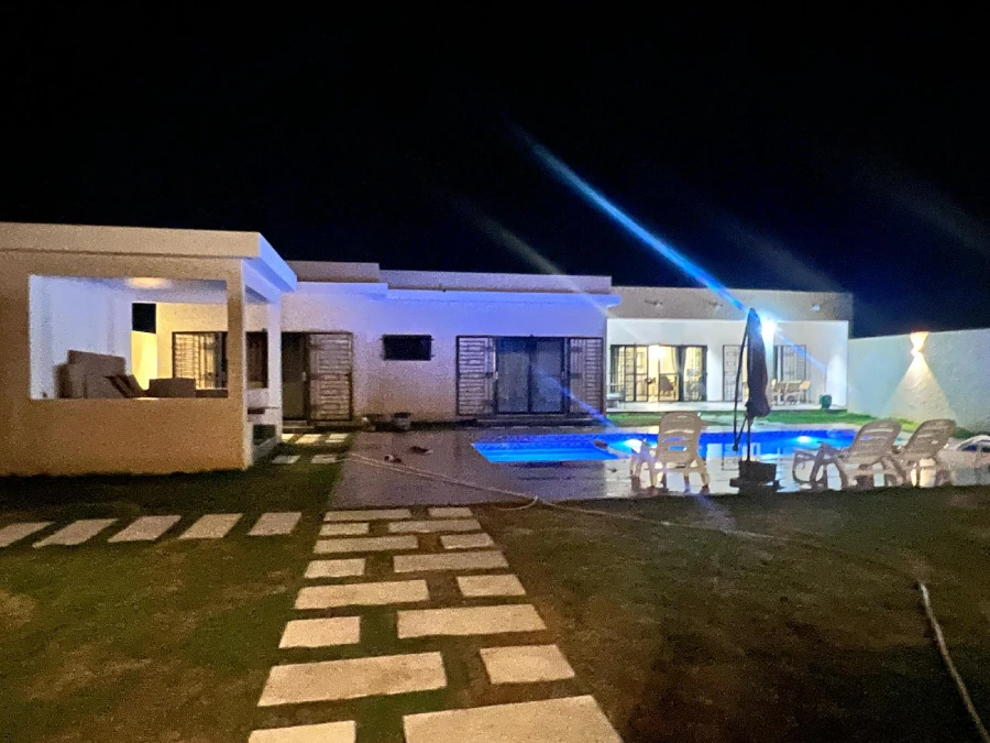 USA modern pool villa exterior at night by George Group