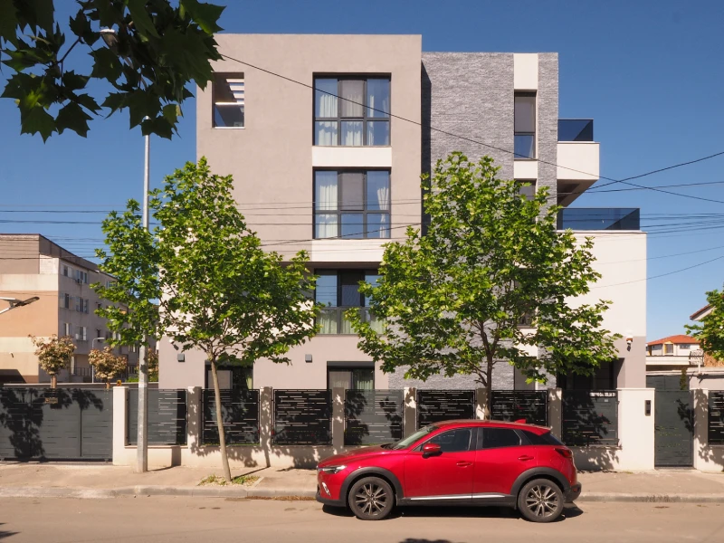 Street view of a Romania apartment building with modern exterior facade