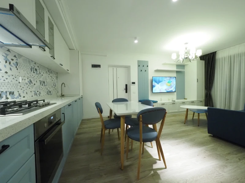 Apartment kitchen and dining area with compact open-plan layout