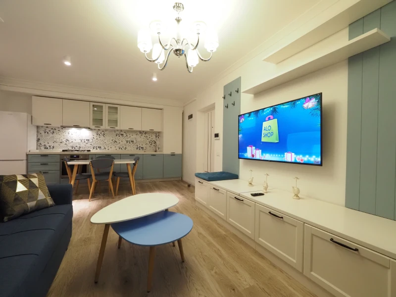 Apartment living room with TV wall cabinet and coordinated interior finishes